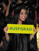 university-of-south-florida-graduate-holding-sign